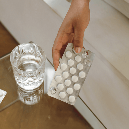 Acne Medication with Water Glass